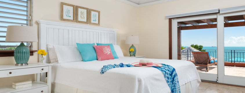 providenciales-oceanfront-villa-la-percha-chalk-sound-bedroom four view to pool