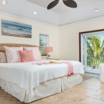 providenciales-oceanfront-villa-la-percha-chalk-sound-bedroom three view to pool