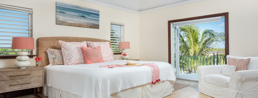 providenciales-oceanfront-villa-la-percha-chalk-sound-bedroom three view to pool