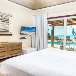 providenciales-oceanfront-villa-la-percha-chalk-sound-bedroom four view to pool
