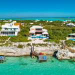 providenciales-oceanfront-villa-la-percha-chalk-sound-drone view of back and pool