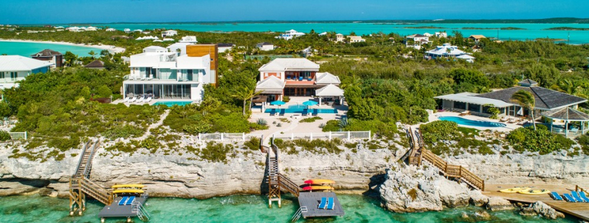 providenciales-oceanfront-villa-la-percha-chalk-sound-drone view of back and pool