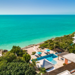 providenciales-oceanfront-villa-la-percha-chalk-sound-drone view of property
