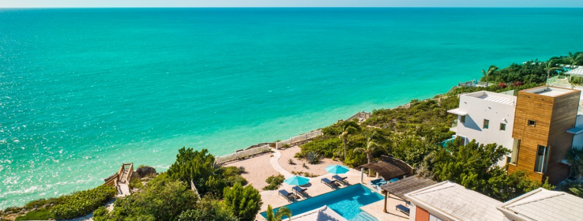 providenciales-oceanfront-villa-la-percha-chalk-sound-drone view of property