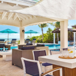 providenciales-oceanfront-villa-la-percha-chalk-sound-outdoor dining under roof