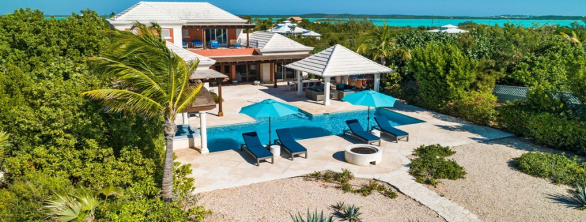 providenciales-oceanfront-villa-la-percha-chalk-sound-drone view of backyard