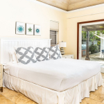 providenciales-oceanfront-villa-la-percha-chalk-sound-bedroom two view to pool