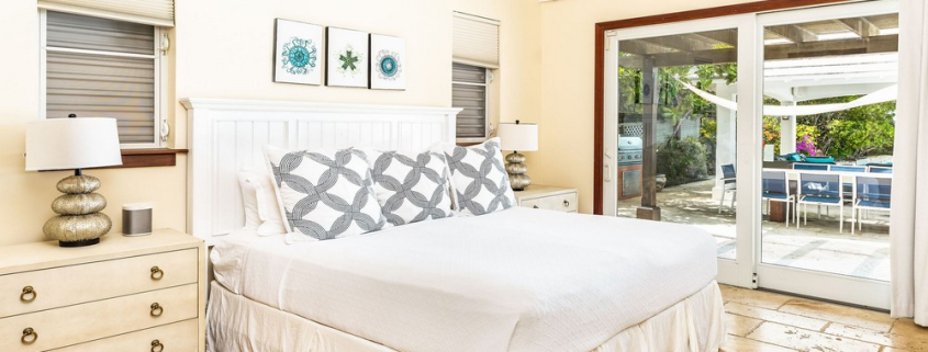 providenciales-oceanfront-villa-la-percha-chalk-sound-bedroom two view to pool