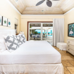 providenciales-oceanfront-villa-la-percha-chalk-sound-bedroom two view to pool