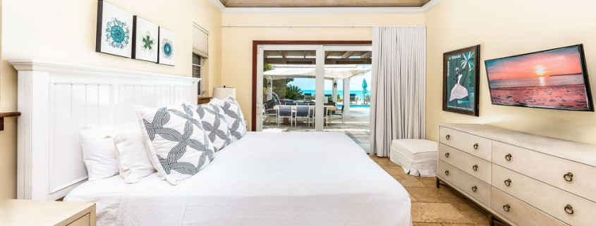 providenciales-oceanfront-villa-la-percha-chalk-sound-bedroom two view to pool