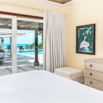 providenciales-oceanfront-villa-la-percha-chalk-sound-bedroom two view to pool