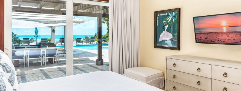 providenciales-oceanfront-villa-la-percha-chalk-sound-bedroom two view to pool