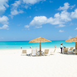 sands-at-grace-bay-beachfront resort lounge chairs in sand