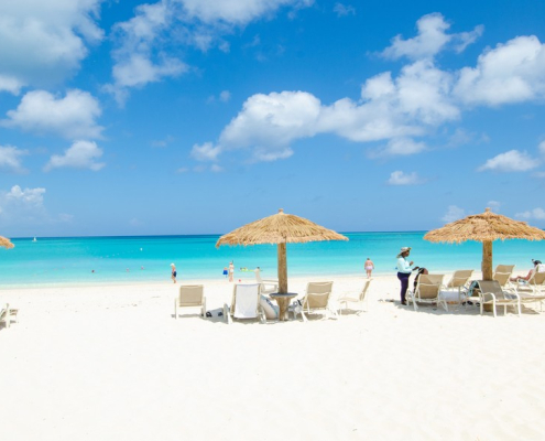 sands-at-grace-bay-beachfront resort lounge chairs in sand