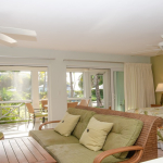 ocean-club-resort-junior-suite -grace-bay-beach-for-sale-1 ocean-club-resort-junior-suite-9107 living area view to porch