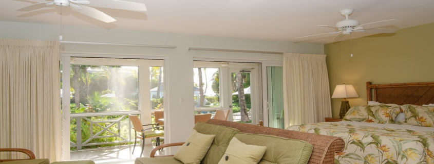 ocean-club-resort-junior-suite -grace-bay-beach-for-sale-1 ocean-club-resort-junior-suite-9107 living area view to porch