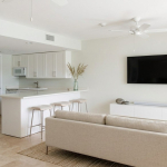 ocean-club-resort-junior-suite -grace-bay-beach-for-sale-4 ocean-club-resort-junior-9107 virtually staged living and kitchen area